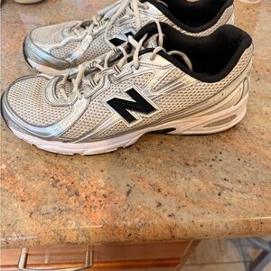 New Balance Metallic Silver and Black Sneakers